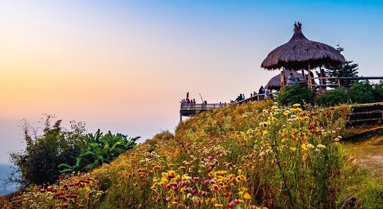 Misty Mae Taeng valley at dawn for a scenic Mae Taeng Tours banner by Legend Travel Group.
